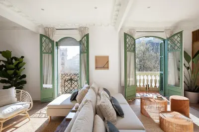 a bedroom with a king sized bed and a desk at Tanah - 3 bedrooms and balcony in Eixample Dreta in Barcelona