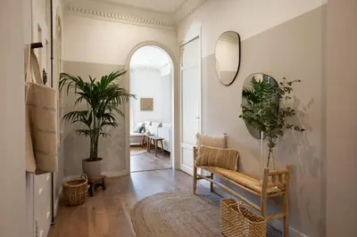 a living room with a couch and a table at Tanah - 3 bedrooms and balcony in Eixample Dreta in Barcelona
