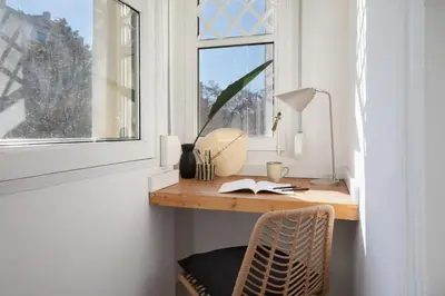 a living room with a white couch and a table at Tanah - 3 bedrooms and balcony in Eixample Dreta in Barcelona