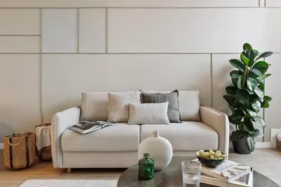 a living room with a couch and a table at Isola - 1 bedroom and terrace in Eixample Dreta in Barcelona