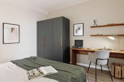 a living room with a couch and a table at Isola - 1 bedroom and terrace in Eixample Dreta in Barcelona