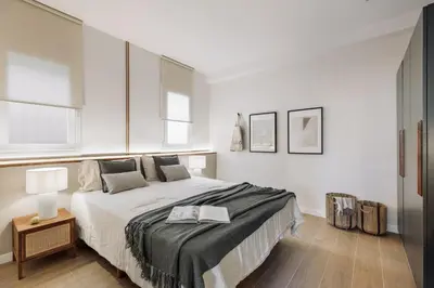 a patio with a couch and chairs on a balcony at Isola - 1 bedroom and terrace in Eixample Dreta in Barcelona