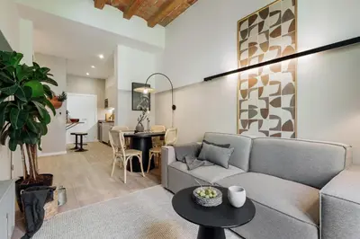a living room with a couch and a table at Xelida - 2 bedrooms and balcony in Sant Antoni in Barcelona
