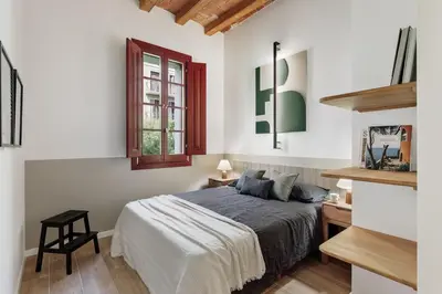 a living room with a couch and a tv at Xelida - 2 bedrooms and balcony in Sant Antoni in Barcelona