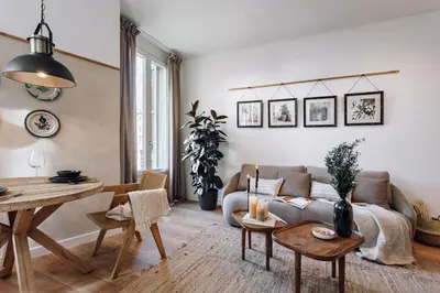 a living room with a table and a couch at Algar - 1 bedroom and balcony in Eixample Esquerra in Barcelona
