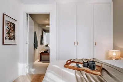 a bedroom with a large bed with a camera on it at Algar - 1 bedroom and balcony in Eixample Esquerra in Barcelona