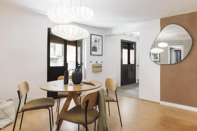 a bedroom with a large bed and a window at Acatenango - 2 bedrooms in El Born in Barcelona