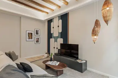 a living room with a green and white wall at Cesme - 2 bedrooms and balcony in Sant Pere in Barcelona