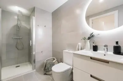 a dining room with a table and chairs and a light fixture at Camerota - 2 bedrooms, terrace and balcony in Ciutat Vella in Barcelona