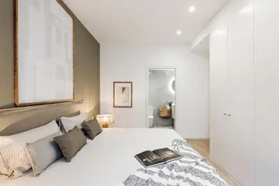 a bedroom with a desk with a computer on it at Camerota - 2 bedrooms, terrace and balcony in Ciutat Vella in Barcelona