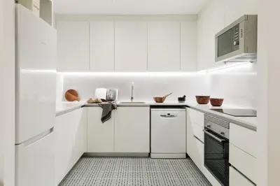 a bedroom with a white bed with a book on it at Camerota - 2 bedrooms, terrace and balcony in Ciutat Vella in Barcelona