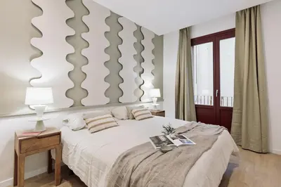 a living room with a couch and a tv at Camerota - 2 bedrooms, terrace and balcony in Ciutat Vella in Barcelona