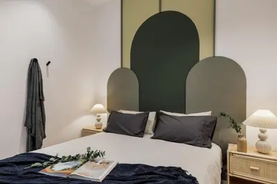 a bedroom with a bed and a shelf on the wall at Sishane - 3 bedrooms and terrace in Eixample Esquerra in Barcelona