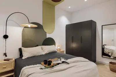 a hallway with two framed pictures on the wall at Sishane - 3 bedrooms and terrace in Eixample Esquerra in Barcelona