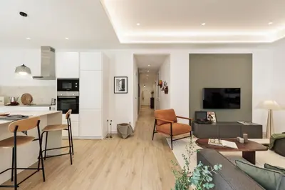 a dining room with a black table and chairs at Sishane - 3 bedrooms and terrace in Eixample Esquerra in Barcelona