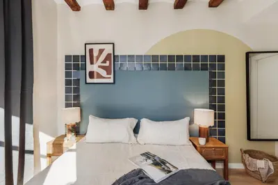 a living room with a couch and a tv at Ipek - 2 bedrooms and balcony in Sant Pere in Barcelona