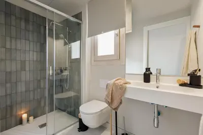 a mirror in front of a bedroom with a bed at Ipek - 2 bedrooms and balcony in Sant Pere in Barcelona