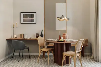 a wooden desk with a chair and a picture on the wall at Niria - 2 bedrooms and balcony in Eixample Esquerra in Barcelona