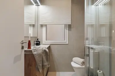 a bedroom with a bed and a mirror at Niria - 2 bedrooms and balcony in Eixample Esquerra in Barcelona
