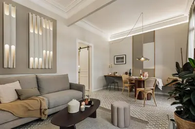 a dining room table with two chairs and a candle at Niria - 2 bedrooms and balcony in Eixample Esquerra in Barcelona