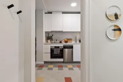 a living room with a couch and a tv at Nal - 2 bedrooms, office and balcony in Eixample Dreta in Barcelona