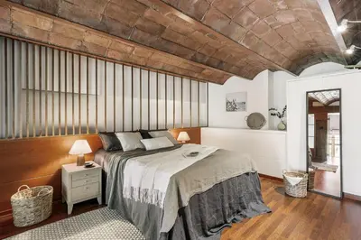 a kitchen with white cabinets and a washer and dryer at Agerola - 2 bedrooms in Eixample Dreta in Barcelona