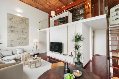 a bedroom with a large bed and a wooden ceiling at Agerola - 2 bedrooms in Eixample Dreta in Barcelona