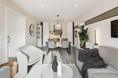 a living room with a couch and a table at Aliga - 3 bedroom and pool in Les Corts in Barcelona
