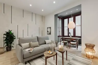 a bedroom with a large bed with a book on it at Cliento - 2 bedrooms and terrace in Ciutat Vella in Barcelona