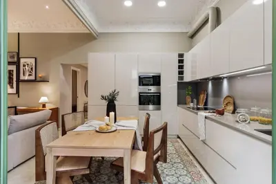 a living room with a tv on a brick wall at Claes - 2 bedrooms and balcony in Sant Gervasi - La Bonanova in Barcelona