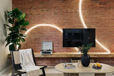 a desk with a lamp next to a brick wall at Claes - 2 bedrooms and balcony in Sant Gervasi - La Bonanova in Barcelona