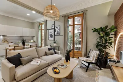 a room with a balcony with a table and chairs at Claes - 2 bedrooms and balcony in Sant Gervasi - La Bonanova in Barcelona