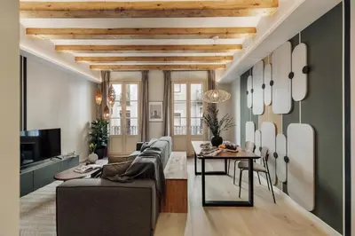 a living room with a couch and a table at Deisis - 2 bedrooms and balcony in Sant Pere in Barcelona