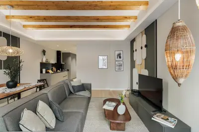 a small bedroom with a bed and a desk at Deisis - 2 bedrooms and balcony in Sant Pere in Barcelona