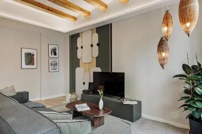 a living room with a couch and a table at Deisis - 2 bedrooms and balcony in Sant Pere in Barcelona