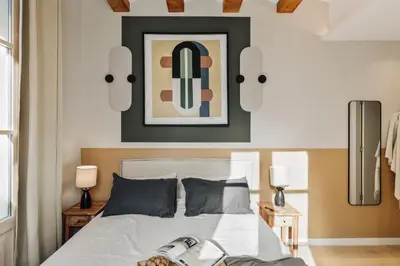 a living room with a couch and a tv at Deisis - 2 bedrooms and balcony in Sant Pere in Barcelona