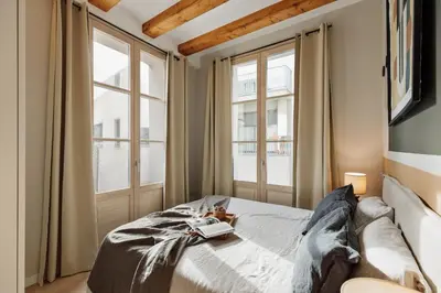 a living room with a couch and a tv at Deisis - 2 bedrooms and balcony in Sant Pere in Barcelona
