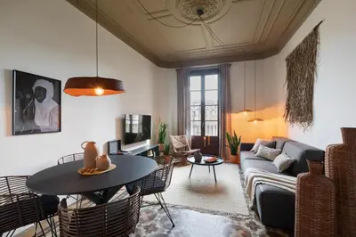 a living room with a couch and a table at Taoudeni - 3 bedrooms in Eixample Esquerra in Barcelona