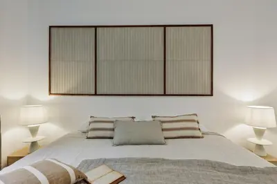 a bedroom with two beds and a desk and a window at Pogerola - 2 bedrooms, balcony and terrace in Ciutat Vella in Barcelona