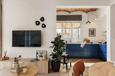 a living room with a couch and a table at Tamar - 2 bedrooms and terrace in Sant Gervasi in Barcelona