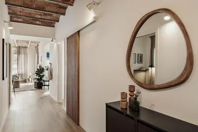 a patio with a table and chairs on a balcony at Tamar - 2 bedrooms and terrace in Sant Gervasi in Barcelona