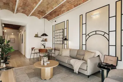 a living room with a table and a couch at Tamar - 2 bedrooms and terrace in Sant Gervasi in Barcelona