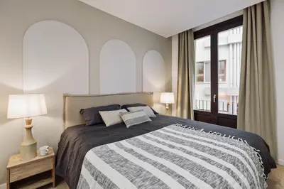 a patio with a couch and a table and chairs at Cantone - 2 bedrooms, balcony and terrace in Ciutat Vella in Barcelona