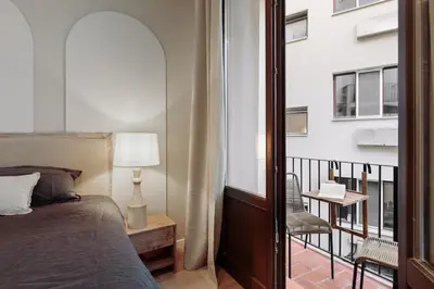 a bathroom with a shower and a toilet and a sink at Cantone - 2 bedrooms, balcony and terrace in Ciutat Vella in Barcelona