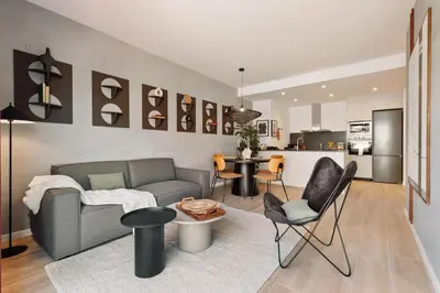 a bedroom with a large bed with a white blanket at Kline - 2 bedrooms and terrace in Sant Antoni in Barcelona