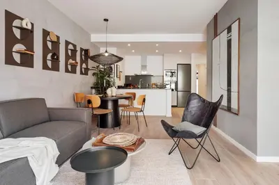 a bedroom with a bed and pictures on the wall at Kline - 2 bedrooms and terrace in Sant Antoni in Barcelona
