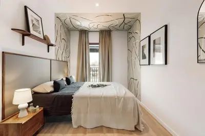 a living room with a couch and chairs and a window at Kline - 2 bedrooms and terrace in Sant Antoni in Barcelona