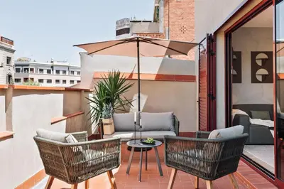 a kitchen and dining room with a table and chairs at Kline - 2 bedrooms and terrace in Sant Antoni in Barcelona
