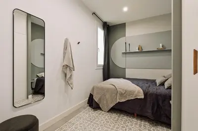 a bedroom with a bed and a mirror at Tikal - 3 bedrooms and balcony in Sant Gervasi in Barcelona