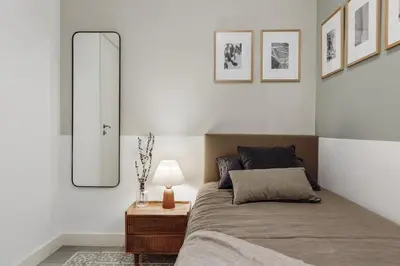a bedroom with a bed with a mirror and a lamp at Tikal - 3 bedrooms and balcony in Sant Gervasi in Barcelona
